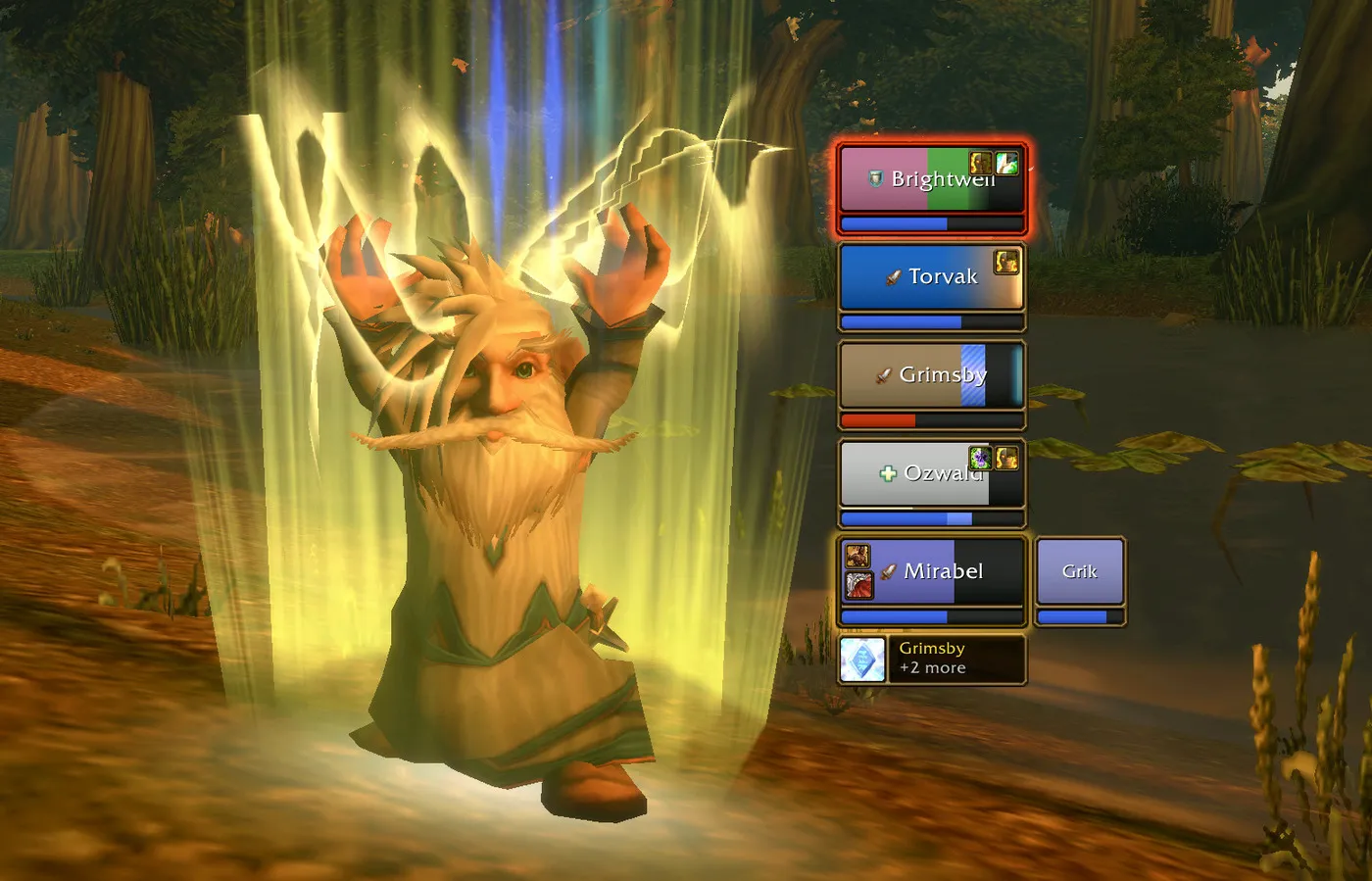 A gnome priest casting a group buff with the Quick Buff button under the HealKit frames